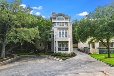 View of front of house featuring a balcony, stone