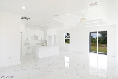 Unfurnished living room featuring sink and a raise