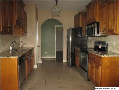 View from the breakfast area through kitchen. All 