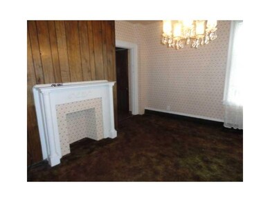 Living Room. Living room with original mantle and 