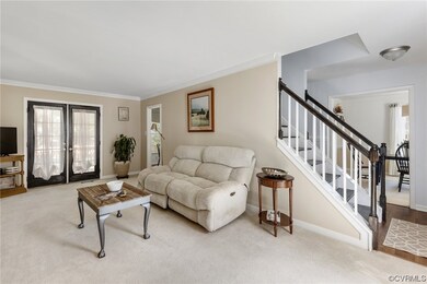 Carpeted living room with plenty of natural light,