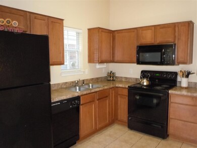 Kitchen has wonderful cabinets and lots of counter
