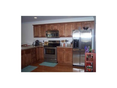 Kitchen. Maple Cabinets, Corian counter tops, Stai