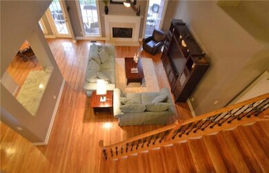 Two-story great room . . . oak treads and risers on stairs . . . iron spindles . . . nice upgrades . . . 