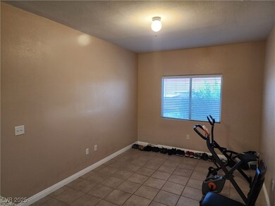 Workout area with light tile patterned flooring an