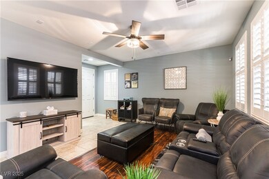 Living room with ceiling fan, baseboards, and ligh