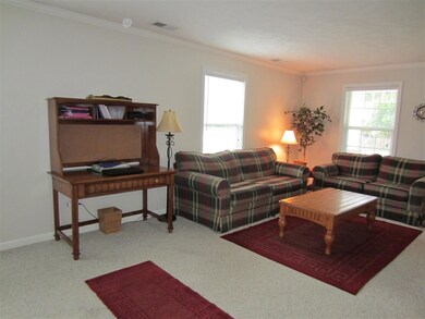 Large Living Room has crown molding, and opens to 