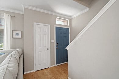 A storage closet with built-in shelving is just to the left of the front door.