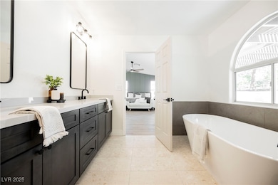 Bathroom with double vanity, ensuite bath, a frees