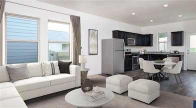 Living room with dark wood-style flooring and rec
