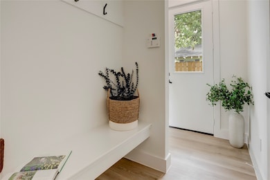Upon entering there is a convenient mud room with