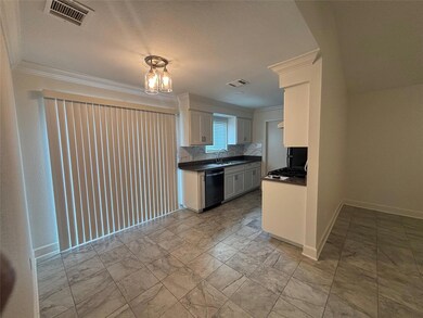 Kitchen featuring visible vents, stainless steel 