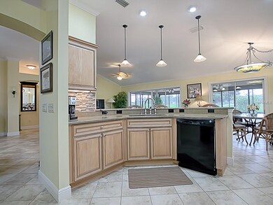 OPEN KITCHEN WITH BREAKFAST BAR ENHANCED WITH PEND