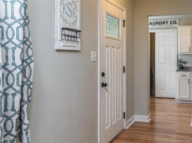 Front entry flows into kitchen and living room.