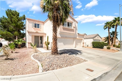 Mediterranean / spanish-style home with a garage,