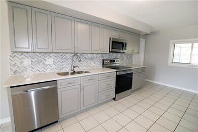 Alternate view of the kitchen.  Ceramic tile floor