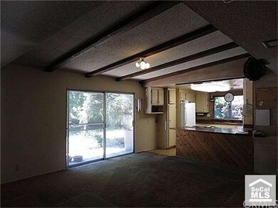Large family room with vaulted ceilings and open t