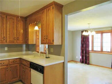 Nice oak cabinetry and white Corian counters all a
