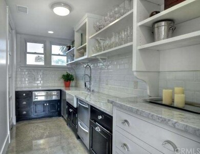Butler's pantry off formal dining room with warmin