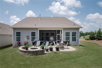 Beautiful Backyard with Screened in Porch and Stone Fire Pit