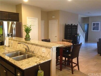 Kitchen View into Family and Bath and Staircase