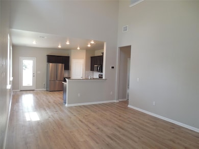 Unfurnished living room featuring light wood-styl