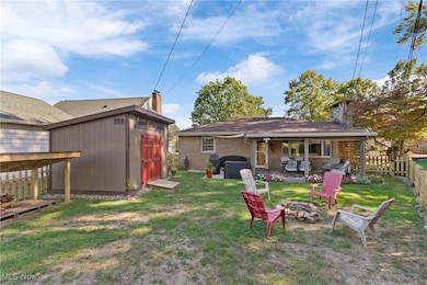Back area of home with outbuilding