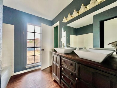 Bathroom with shower / bath combination, vanity, a