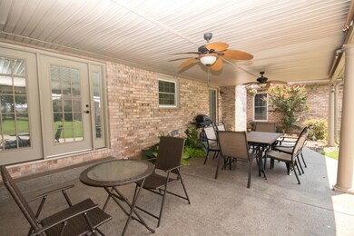 Plenty of room for lots of guest under the patio with roll down shades for added privacy.  Enter into the kitchen area or an entry to the sun room. 