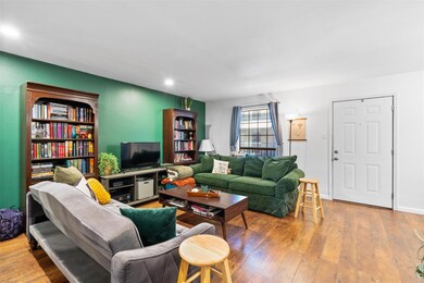 Living area featuring recessed lighting, wood-typ