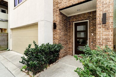 Covered front porch with lovely front door.