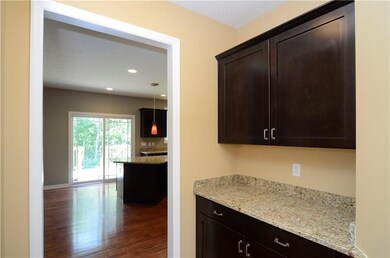 Butler's pantry leading from dining room into kitc