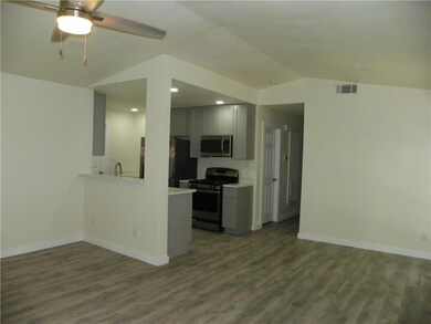 Kitchen featuring appliances with stainless steel