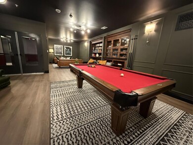 Rec room featuring pool table, wood finished floo