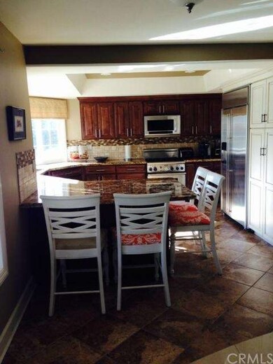 Remodeled kitchen open to family room.