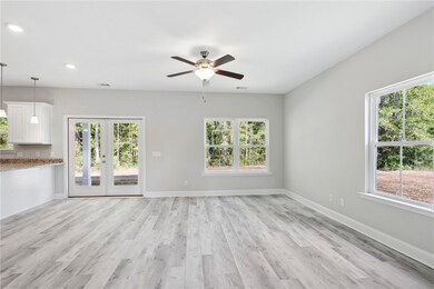 Great room with multiple windows.