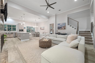Living area featuring stairway, ceiling fan, rece