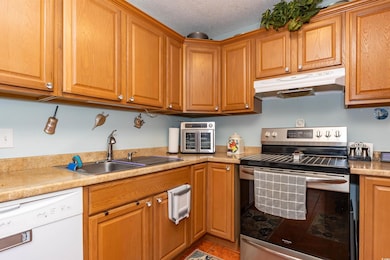 Kitchen featuring stainless steel range with elect