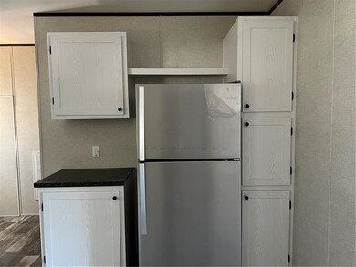 Bright white cabinets and new refrigerator