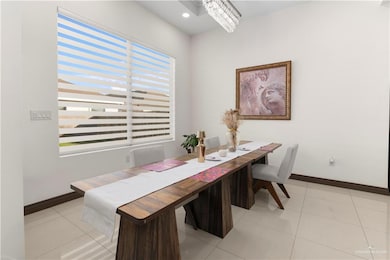 Dining space with light tile patterned floors, recessed lighting, and a chandelier