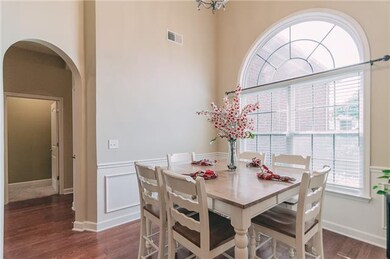 Dining Room-10x8 with Hardwood Floor, 14 foot Ceiling, Double Arched Window, Wainscoting and Chair Rail