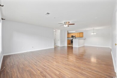 Unfurnished living room featuring light hardwood /