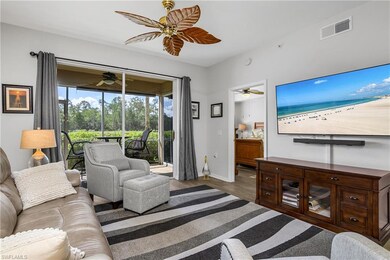 Living area with ceiling fan and wood finished floors