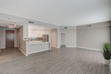 Unfurnished living room featuring visible vents an