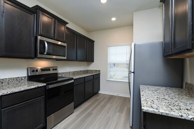 This home comes loaded with a full suite of energy-efficient kitchen appliances by Whirlpool.