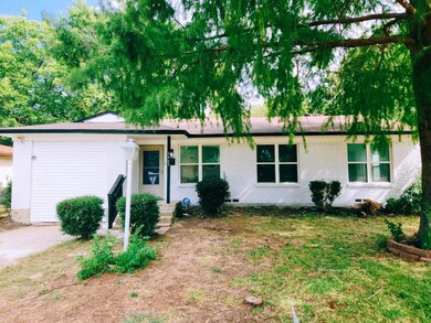 Ranch-style home with a front lawn