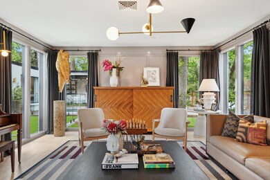 This sophisticated FORMAL LIVING ROOM or private S
