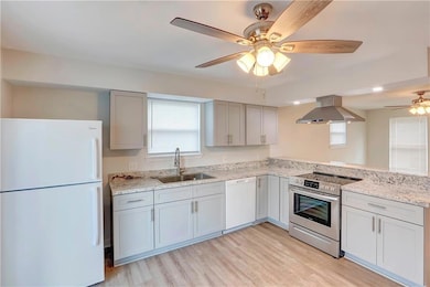 Refrigerator/freezer remains; updated kitchen counter and cabinets; electric stove/oven