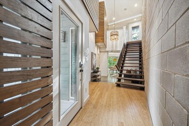 Foyer entrance with plenty of natural light, hard