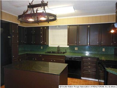Kitchen with newer appliances and pot rack that wi